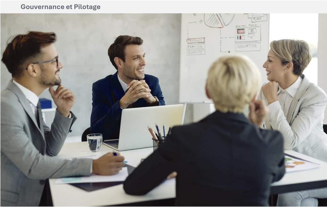 Plusieurs professionnels échangent autour d’un schéma d’organisation et de documents de travail.